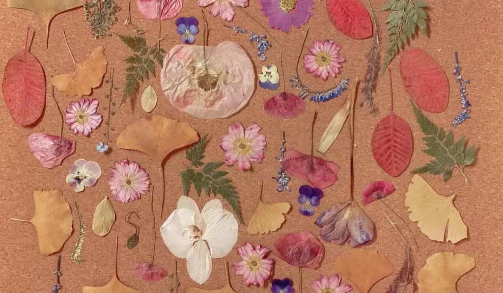 A quilt with stitched flowers is a quilt decorated with fabric flower