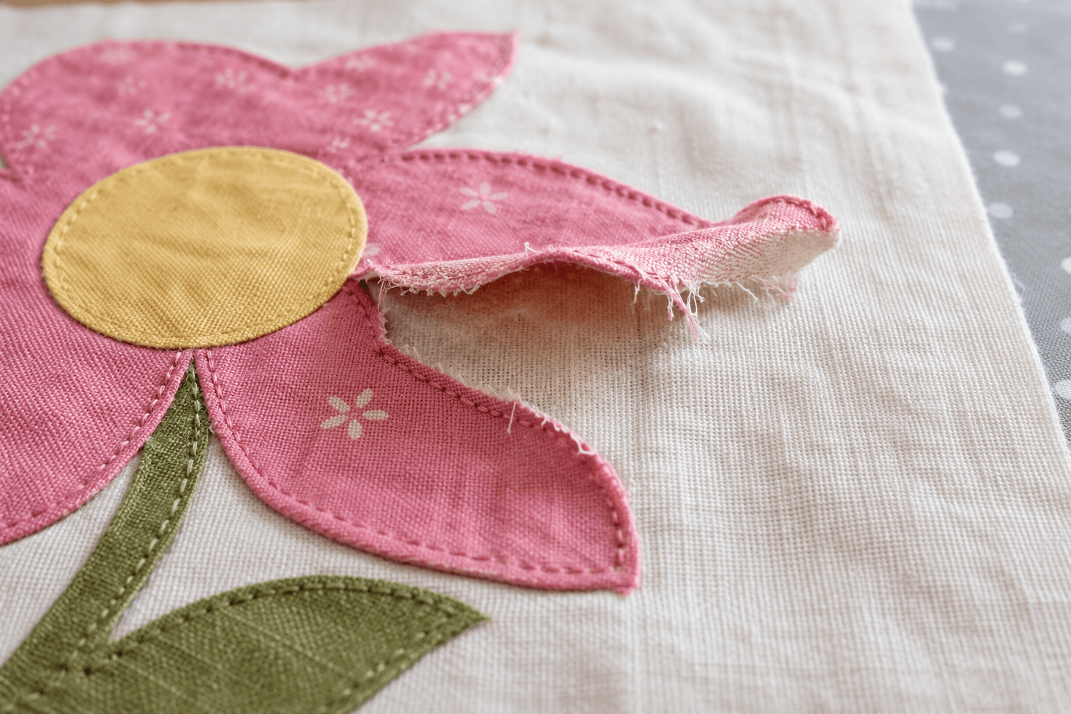 appliqué not sticking with peeling edges due to fusible web failure